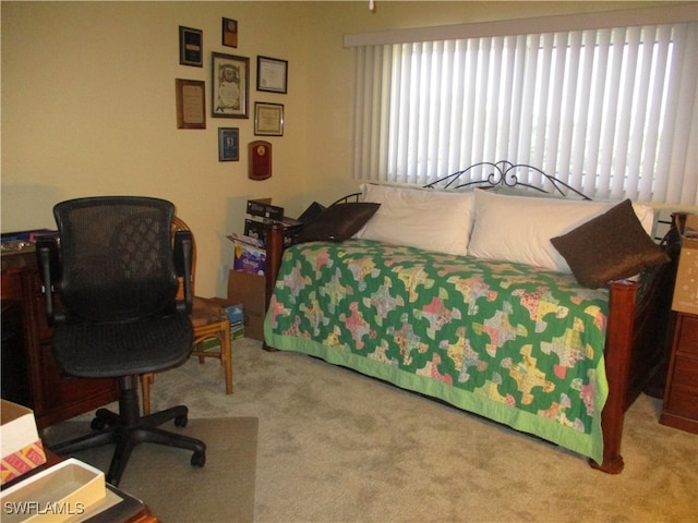 carpeted bedroom featuring multiple windows