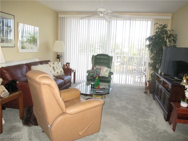 living room featuring ceiling fan and light colored carpet