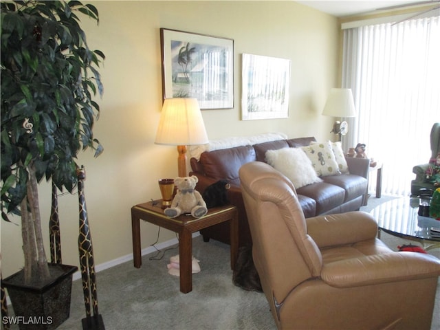 living room featuring light carpet and a healthy amount of sunlight