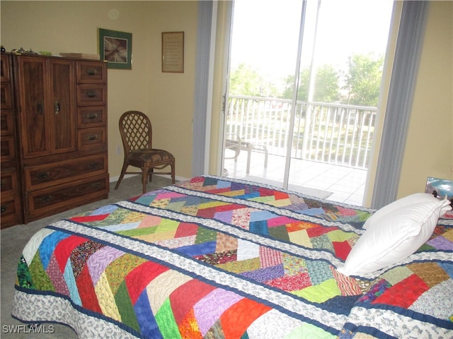 carpeted bedroom featuring access to outside