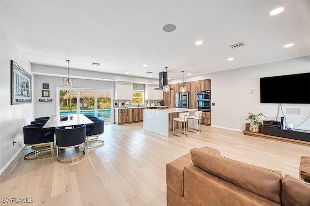 living room with light hardwood / wood-style flooring