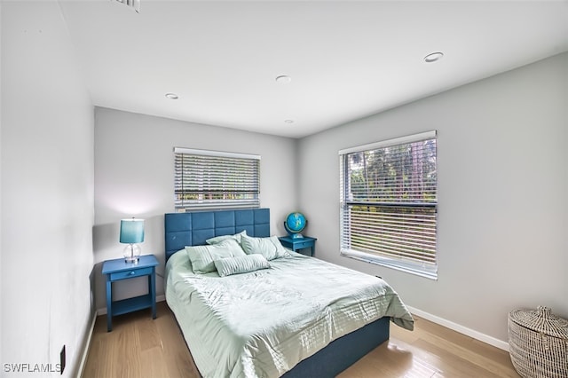 bedroom with hardwood / wood-style flooring