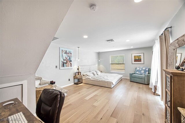 bedroom with light hardwood / wood-style flooring