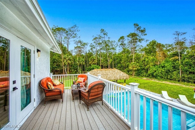 wooden terrace with a yard