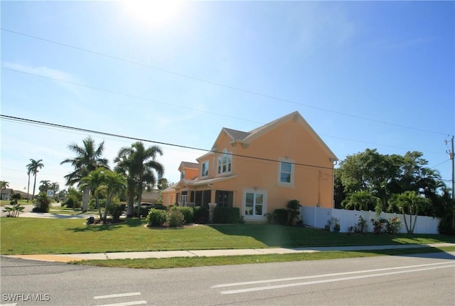 view of front of home featuring a front lawn