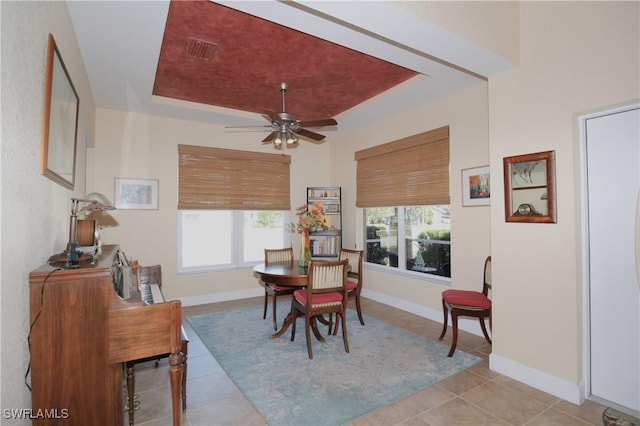 tiled dining room with ceiling fan