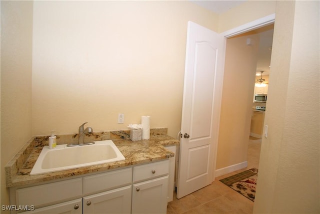 bathroom with tile patterned floors and vanity