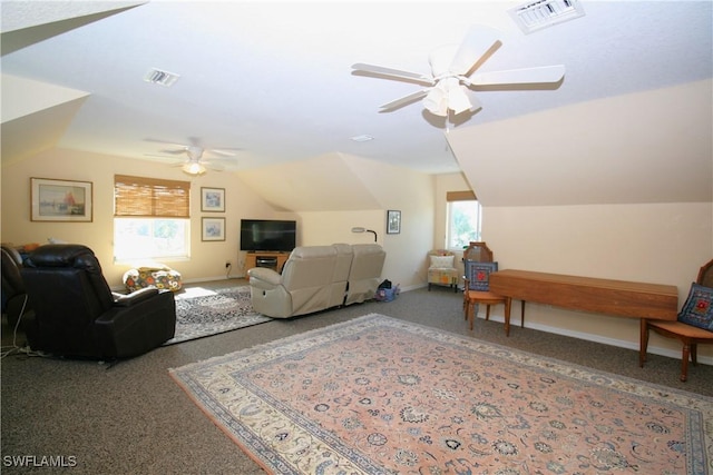 carpeted living room featuring vaulted ceiling, plenty of natural light, and ceiling fan