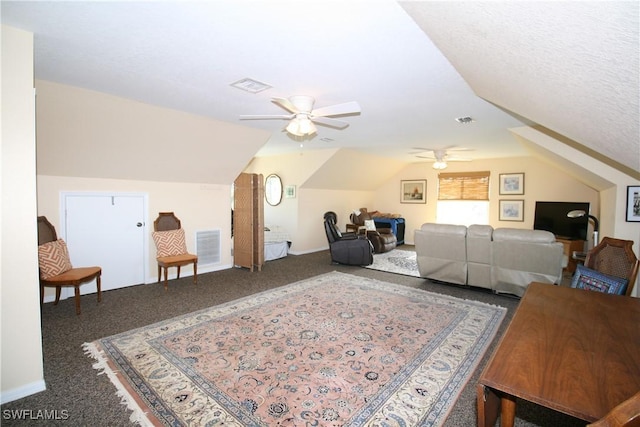 interior space with carpet flooring, ceiling fan, a textured ceiling, and lofted ceiling