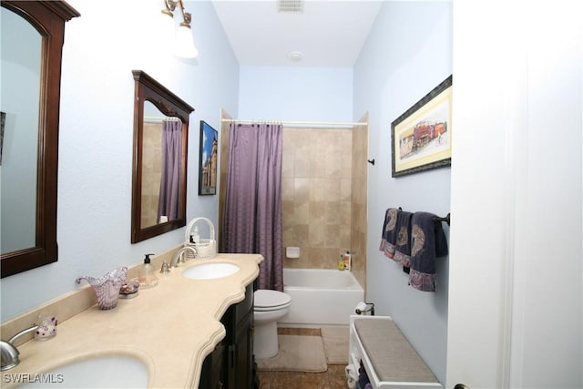 full bathroom with tile patterned flooring, shower / bath combination with curtain, toilet, and vanity