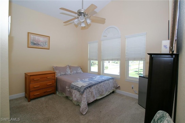 bedroom featuring light carpet, ceiling fan, and lofted ceiling