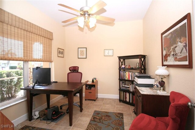 office space featuring ceiling fan and light tile patterned floors