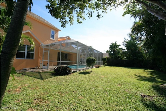 view of yard featuring a lanai