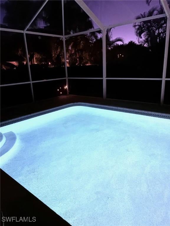 view of pool with a lanai