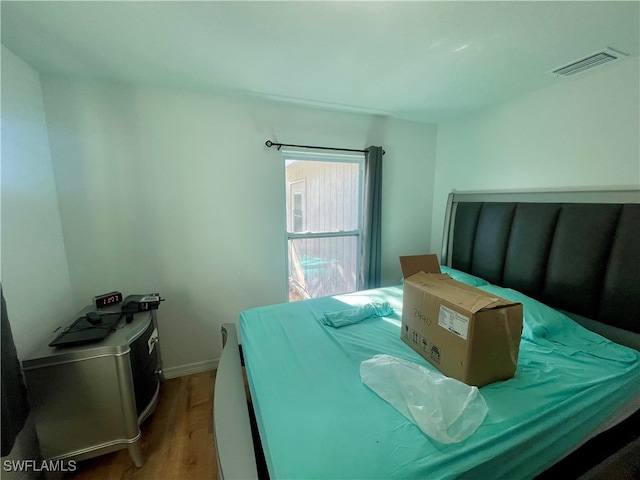 bedroom with light hardwood / wood-style flooring