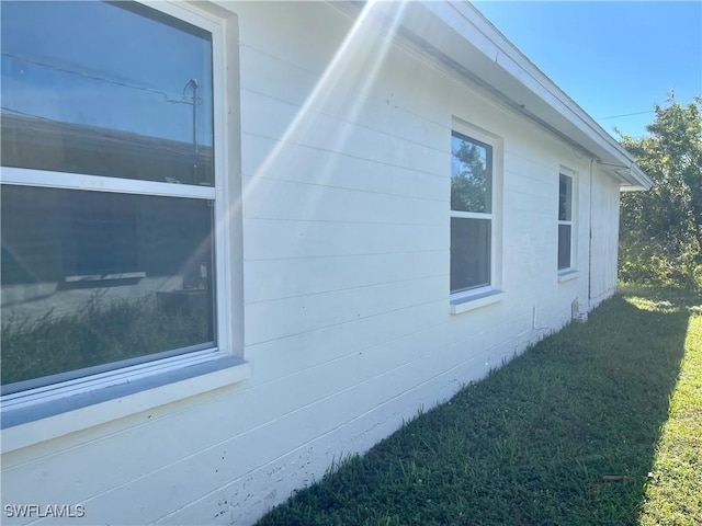 view of home's exterior featuring a lawn