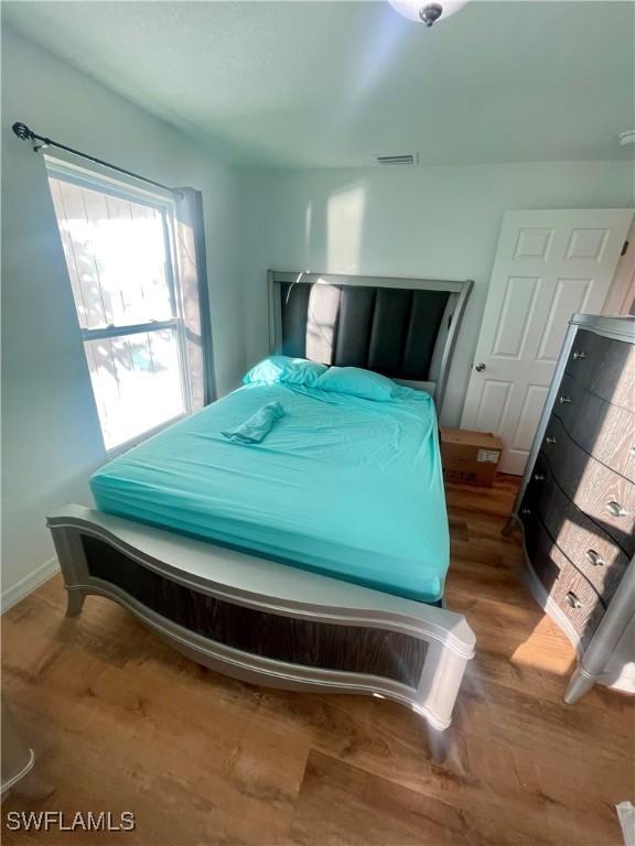 bedroom featuring hardwood / wood-style floors