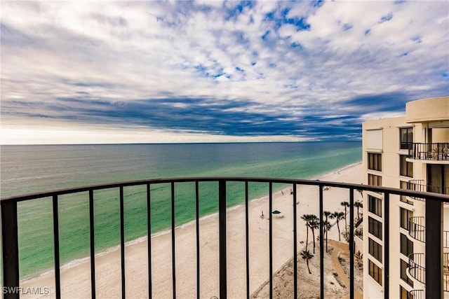 balcony with a view of the beach and a water view