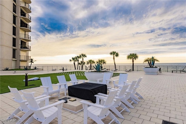 patio terrace at dusk with a water view