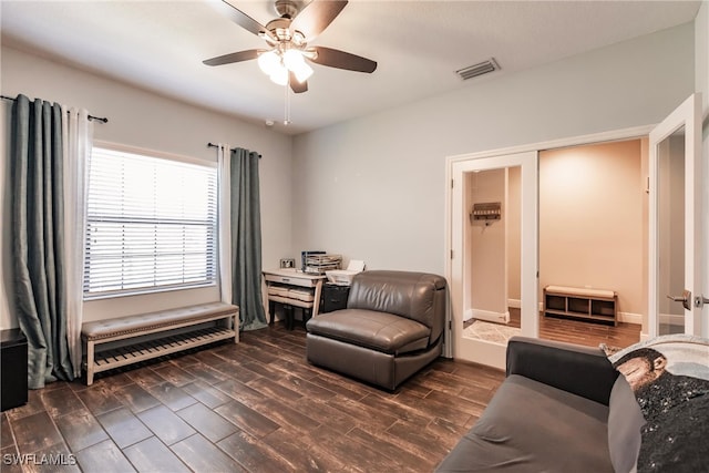 sitting room featuring ceiling fan, french doors, and dark hardwood / wood-style floors