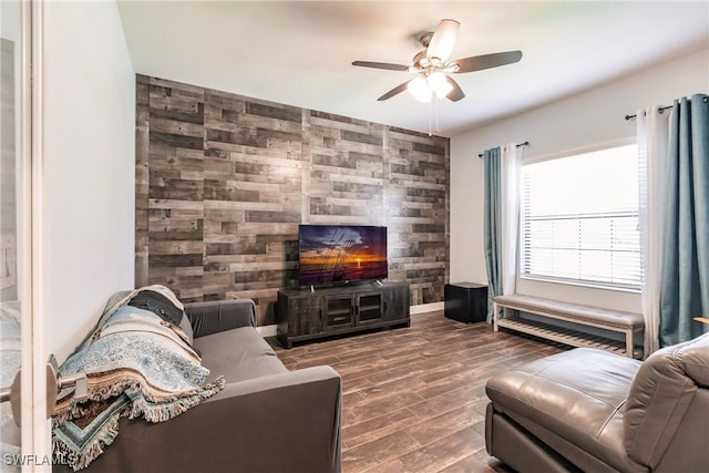 living room with hardwood / wood-style flooring and ceiling fan