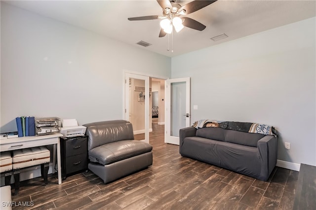 living room featuring ceiling fan, french doors, and dark wood-type flooring