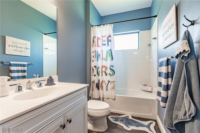 full bathroom featuring toilet, vanity, and shower / tub combo with curtain