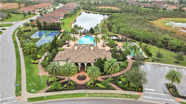 birds eye view of property featuring a water view