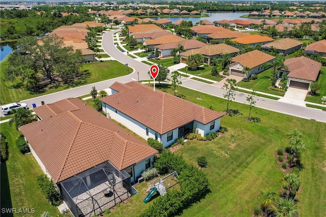 drone / aerial view with a water view