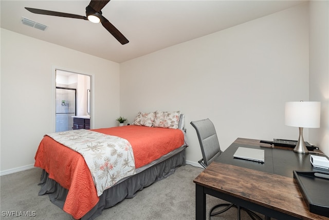 carpeted bedroom with connected bathroom and ceiling fan