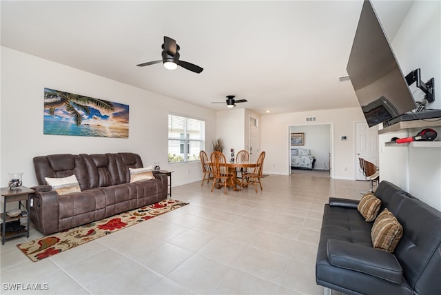 tiled living room featuring ceiling fan