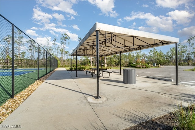 surrounding community with tennis court