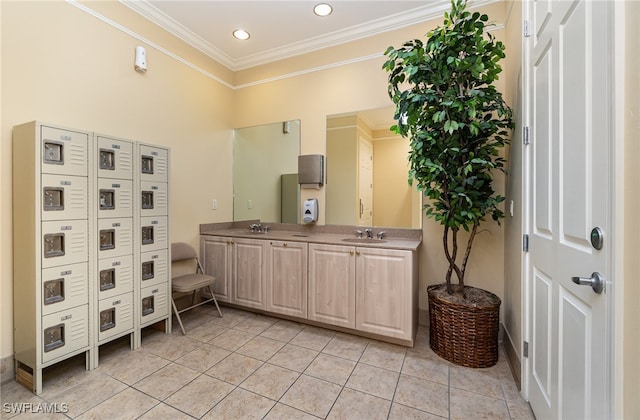 bathroom featuring vanity, tile patterned floors, and crown molding