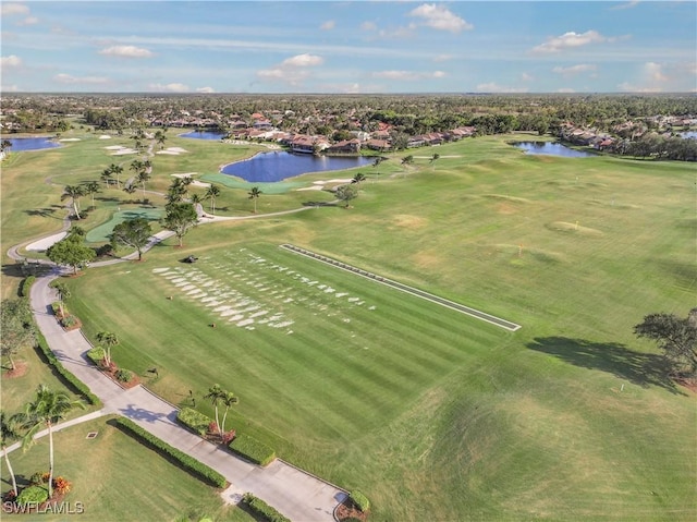 aerial view with a water view and golf course view