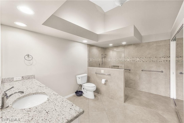 bathroom featuring a walk in shower, tile patterned flooring, toilet, recessed lighting, and vanity