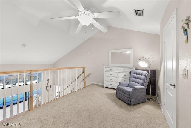 living area with carpet, vaulted ceiling with beams, visible vents, ceiling fan, and an upstairs landing