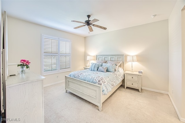 bedroom with light colored carpet and ceiling fan