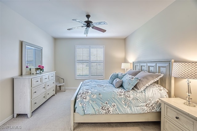 bedroom featuring ceiling fan and light colored carpet