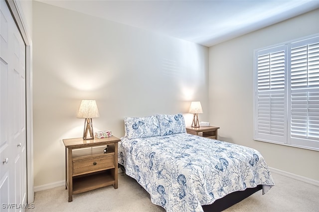 carpeted bedroom featuring a closet