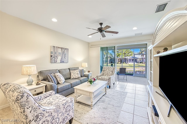 tiled living room featuring ceiling fan