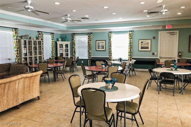 dining area featuring ceiling fan and crown molding