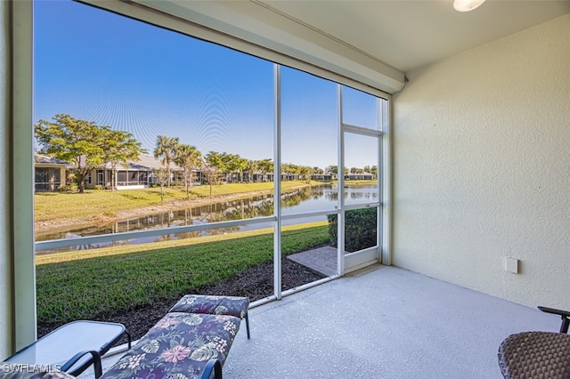 sunroom with a water view