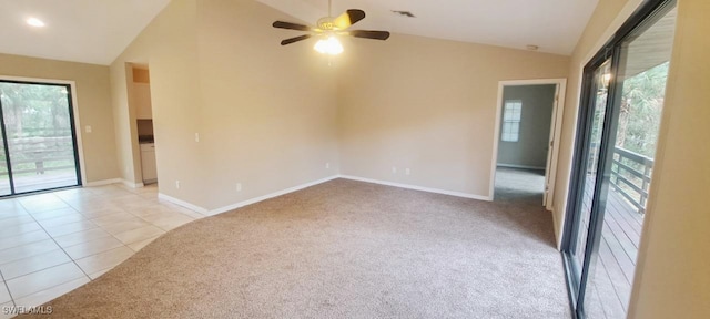 carpeted empty room with ceiling fan and vaulted ceiling