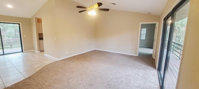 880 Wilson Blvd N, Naples, FL 34120 - spare room featuring vaulted ceiling, light carpet, plenty of natural light, ceiling fan, and light tile patterned floors