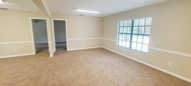 880 Wilson Blvd N, Naples, FL 34120 - carpeted spare room with baseboards