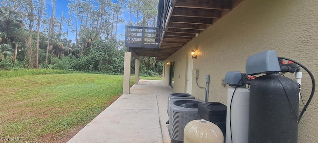 exterior space with central AC unit, a patio area, and a balcony