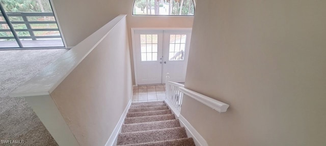 staircase featuring tile patterned floors