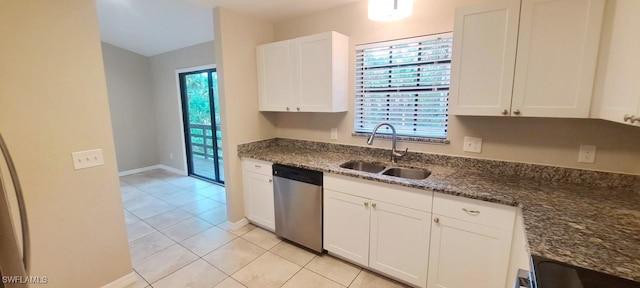 kitchen with light tile patterned floors, white cabinetry, stainless steel dishwasher, and sink