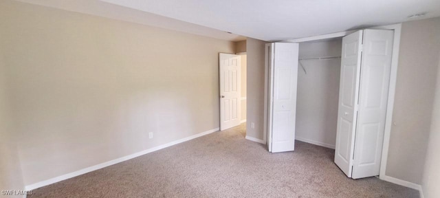 880 Wilson Blvd N, Naples, FL 34120 - unfurnished bedroom with carpet floors and a closet
