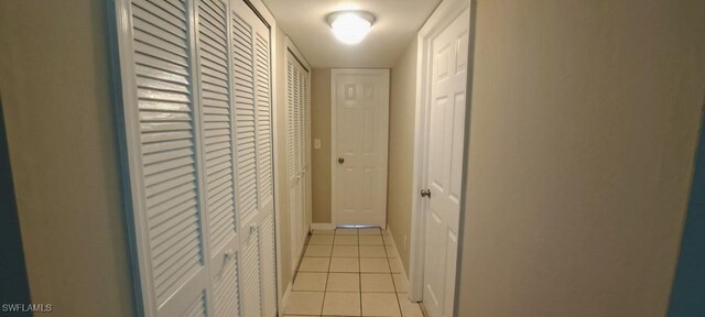 880 Wilson Blvd N, Naples, FL 34120 - corridor with light tile patterned flooring